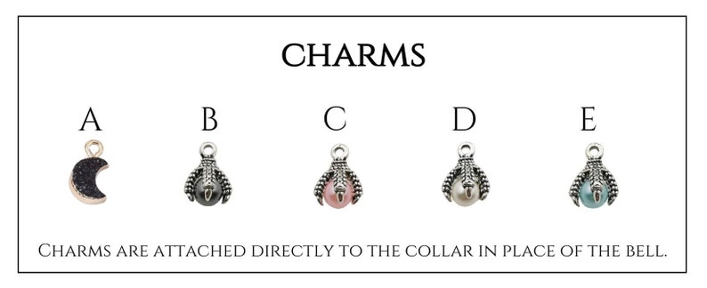 May include: Five different charms for a pet collar. The charms are silver with a small pearl or gemstone in the center. The charms are labeled A through E. Charm A is a crescent moon with black glitter. Charm B is a paw print with a black pearl. Charm C is a paw print with a pink pearl. Charm D is a paw print with a light blue pearl. Charm E is a paw print with a dark blue pearl. The text "CHARMS ARE ATTACHED DIRECTLY TO THE COLLAR IN PLACE OF THE BELL." is below the charms.