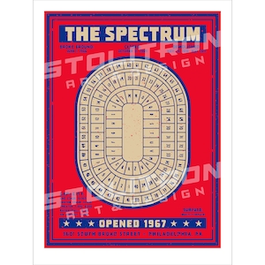 May include: A vintage poster for The Spectrum, a sports arena in Philadelphia, Pennsylvania. The poster features a red background with a white and blue illustration of the arena's seating chart. The text "THE SPECTRUM" is in blue and white lettering. The poster also includes the text "OPENED 1967" and the address "3601 SOUTH BROAD STREET - PHILADELPHIA, PA".