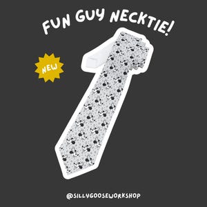 May include: A light gray necktie with a repeating pattern of black and white cartoon character faces and stars. The text "FUN GUY NECKTIE!" is above the tie, and a yellow starburst with "NEW" is to the left. The shop's name is at the bottom.