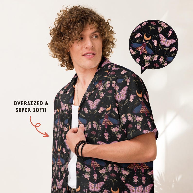 May include: A black short-sleeve button-down shirt featuring a repeating pattern of moths, crescent moons, and pink flowers. The shirt includes a text graphic that reads OVERSIZED & SUPER SOFT! and a circular inset showing the detailed print.
