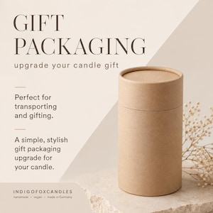 May include: A cylindrical brown cardboard gift tube with a matching lid. The text reads: GIFT PACKAGING, upgrade your candle gift, Perfect for transporting and gifting. A simple, stylish gift packaging upgrade for your candle. INDIGOFOXCANDLES handmade vegan made in Germany.