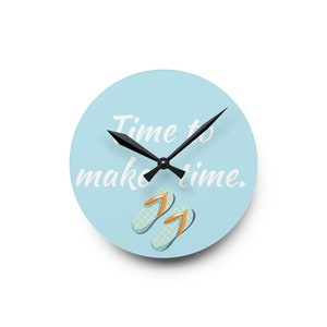 May include: A light blue round clock with black hands and the text "Time to make time."  Two blue flip-flops with orange straps are at the bottom of the clock.