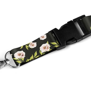 Bloemen drukken lanyard op een zwarte achtergrond met veiligheidsklem en Zwarte KaartHouder 20mm