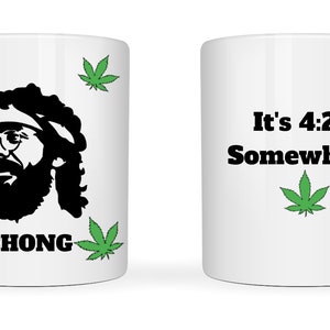 May include: White ceramic mug with a black silhouette of a man with a beard and glasses, surrounded by green cannabis leaves. The word "CHONG" is printed below the silhouette. The other side of the mug has the text "It's 4:20 Somewhere" with a green cannabis leaf.