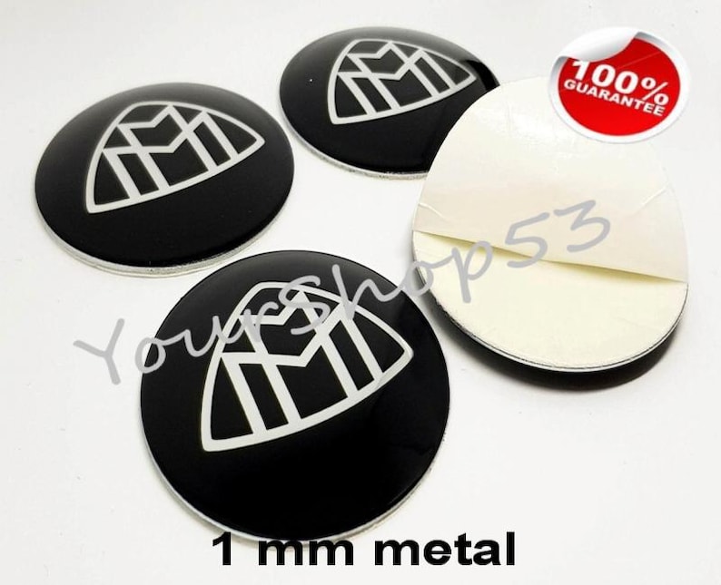 May include: Four black and white car emblems with a geometric design. The emblems are 1 mm metal and have adhesive backing. 100% Guarantee.