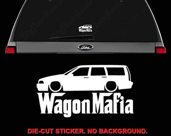 May include: White die-cut vinyl sticker of a wagon car silhouette with the text "Wagon Mafia" in white letters. The sticker is shown on the back window of a silver SUV. The sticker is available in a variety of colors.