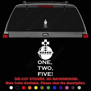May include: White die-cut vinyl sticker of a stylized orb with a cross on top and the text "ONE, TWO, FIVE!" in red. The sticker is on the back window of a silver SUV. The sticker is available in multiple colors.