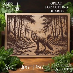 May include: A laser cut design of a fox standing in a forest with trees and a stream. The design is on a wooden board and is great for cutting boards.