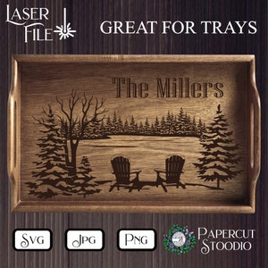 May include: A wooden tray with a laser-engraved design of a winter scene with two chairs and the text "The Millers".