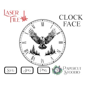 May include: Black and white clock face design featuring an eagle in flight with trees on either side. The clock face has Roman numerals for the hours. The text "CLOCK FACE" is in black text above the clock face.