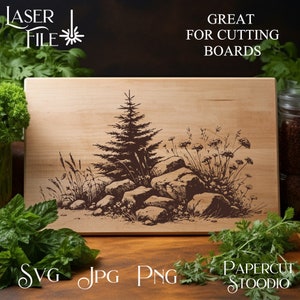 May include: A laser cut design of a pine tree and rocks on a wooden cutting board. The design is in brown and black on a light wood background. The text "GREAT FOR CUTTING BOARDS" is at the top of the image.