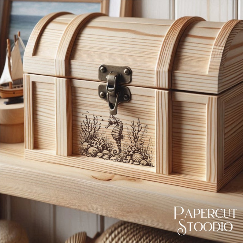 May include: A wooden treasure chest with a hinged lid and a brass latch. The chest is decorated with an engraved image of a seahorse and coral.