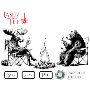 May include: Black and white illustration of a moose and a bear sitting in camping chairs around a campfire. The moose is wearing a plaid shirt and the bear is wearing a plain shirt. Both are holding mugs. The image is labeled "LASER FILE" and "PAPERCUT STOODIO".