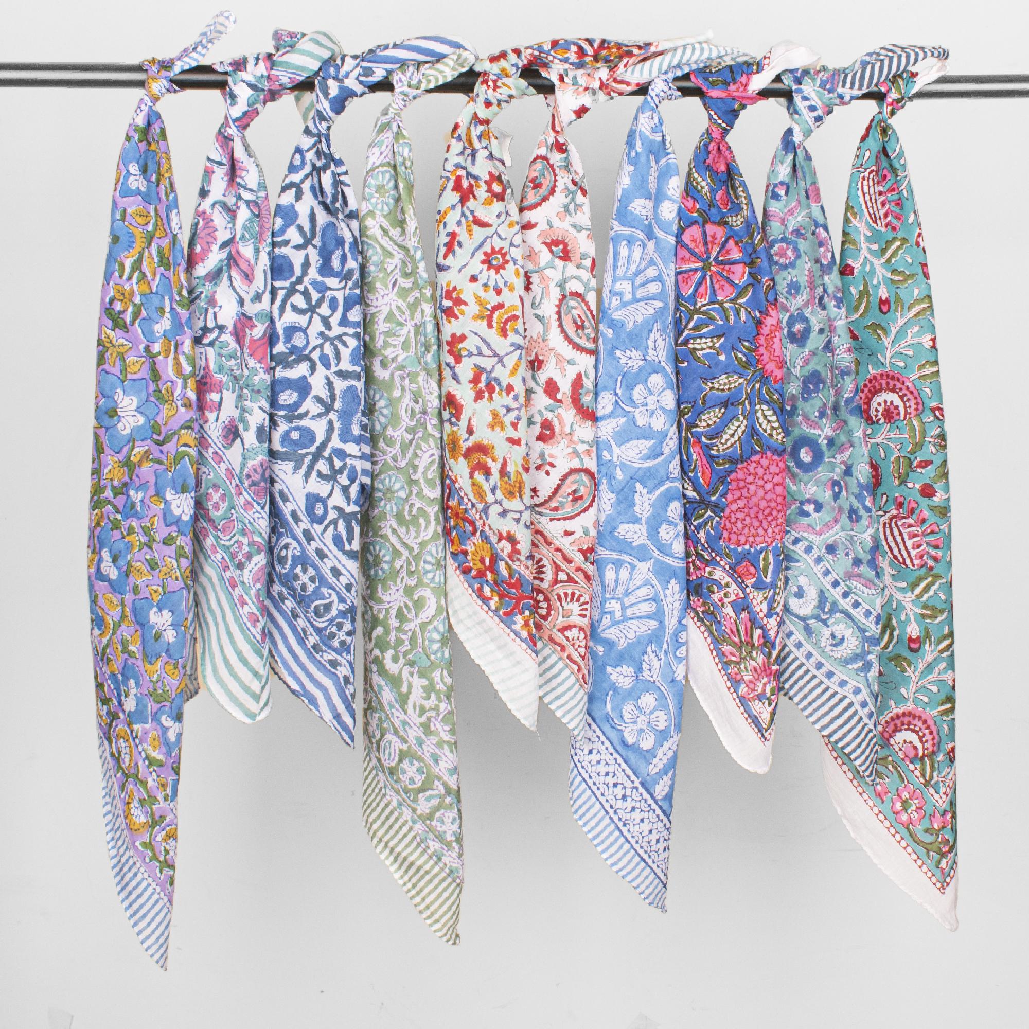 A collection of 10 block print bandanas in floral patterns and earthy tones