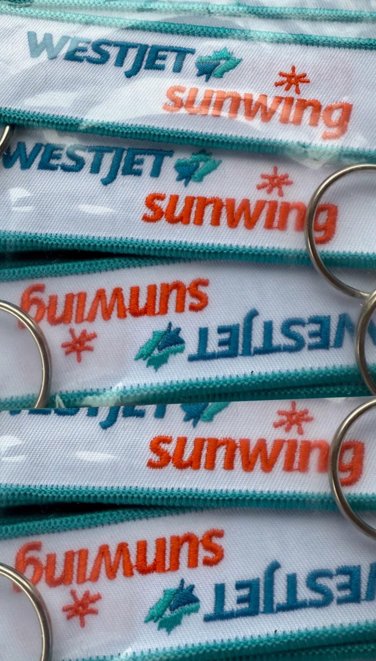 Porte-clés/étiquette à bagage Westjet Sunwing