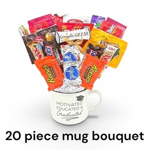 May include: A white mug with the text "MOTIVATED EDUCATED & GRADUATED" holds a bouquet of assorted candy bars. The bouquet includes Reese's, Twix, and York candies, with a scroll that reads "Congrats GRADI!" The image also includes the text "20 piece mug bouquet".