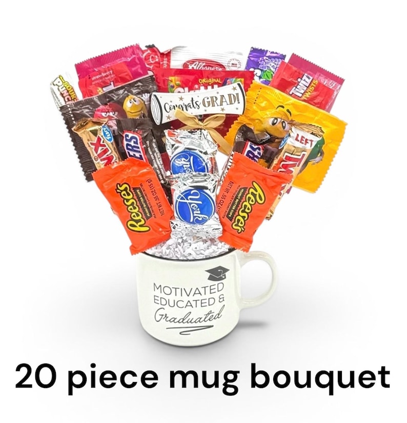 May include: A white mug with the text "MOTIVATED EDUCATED & GRADUATED" holds a bouquet of assorted candy bars. The bouquet includes Reese's, Twix, and York candies, with a scroll that reads "Congrats GRADI!" The image also includes the text "20 piece mug bouquet".