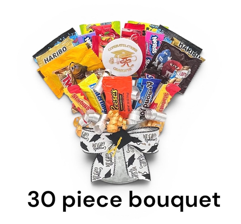 May include: A candy bouquet with a graduation theme. The bouquet includes various candy bars and treats, a graduation cap, and a "Congratulations Graduate" button. The base is wrapped with ribbons that say "Congrats Grad".