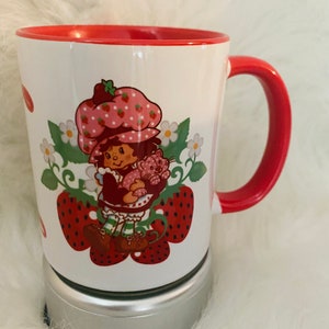 Strawberry Shortcake 11oz Cermaic Coffee Mug.  Red and White in Color Image on both sides. Personalized with a name