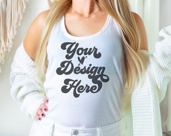 Puede incluir: Camiseta blanca de tirantes con el texto "Your Design Here" en un estilo de fuente retro.