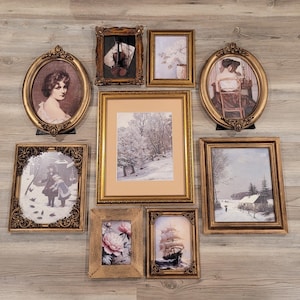 May include: A collection of nine framed vintage art prints in various shapes and sizes. The frames are gold-toned with ornate detailing. The prints depict portraits, landscapes, and still life scenes, creating a classic and elegant aesthetic.
