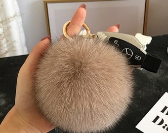 lv pom pom keychain