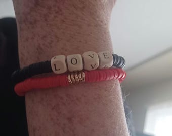 Heishi bracelets black, red and gold.