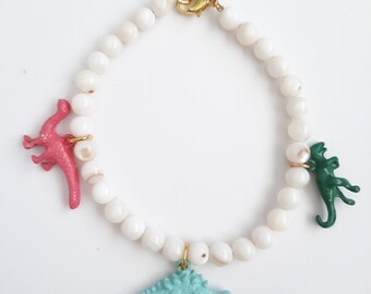 Dinosaurs on a shell bracelet!