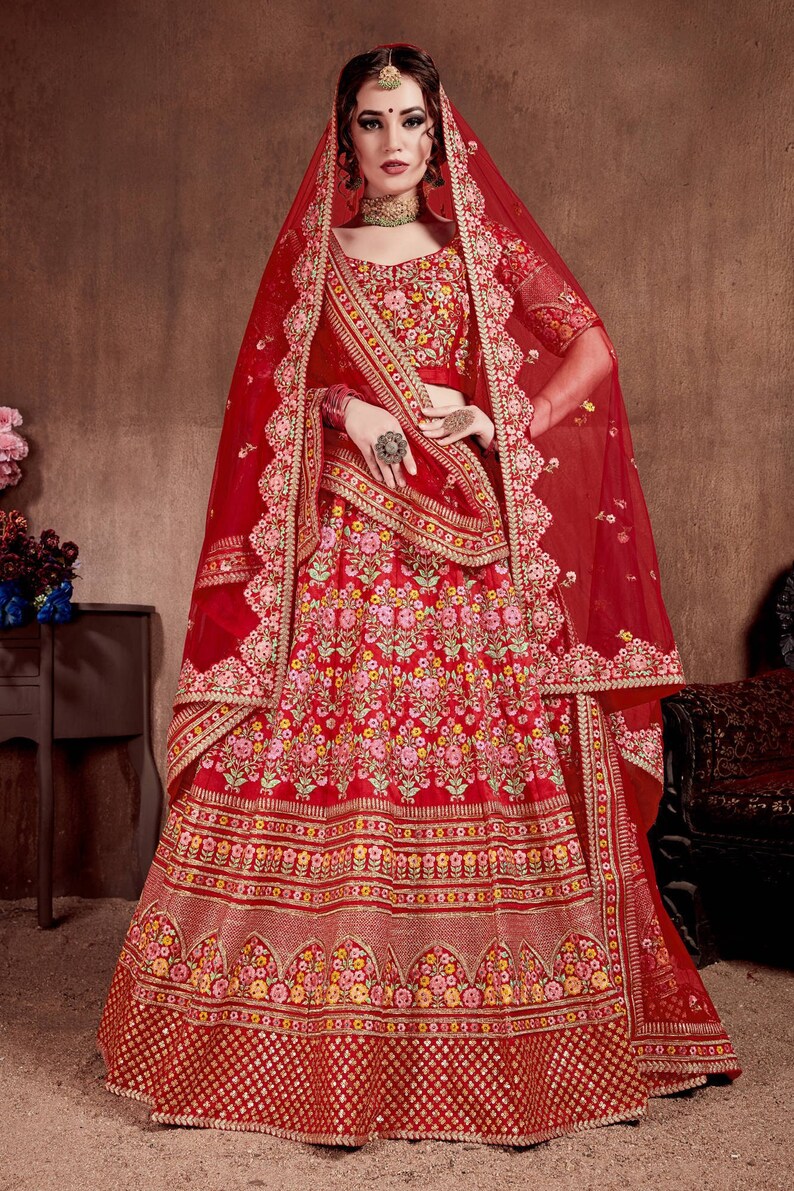Be the bride of your dreams with this rare red bridal lehenga reeking of its classic stature For Indian shops Wedding Wear