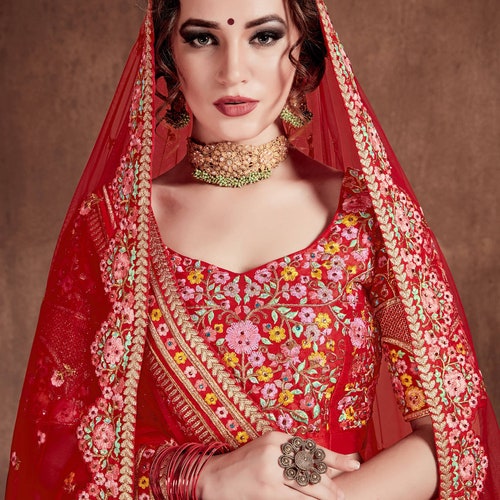 Be the bride of your dreams with this rare red bridal lehenga reeking of its classic stature For Indian shops Wedding Wear