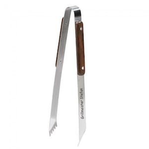 May include: Stainless steel grilling tongs with a wooden handle. The tongs have a serrated edge and the handle has the text "Grillmeister Stefan" engraved on it.