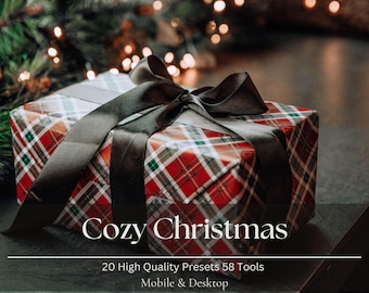 May include: A wrapped gift box with a red and green plaid pattern, tied with a dark brown satin ribbon. The words "Cozy Christmas" are displayed on the front of the box, with additional text below.