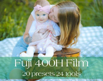 May include: A mother kisses a baby wearing a pink dress and headband. The baby sits on a wooden chest atop a checkered blanket. The image includes the text "Fuji 400H Film, 20 presets 24 tools."