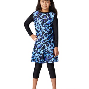May include: A blue and black swimsuit with a leopard print. The swimsuit has long sleeves and a skirt.