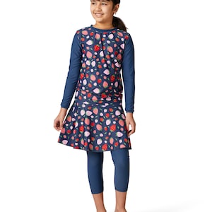 May include: A navy blue swimsuit with long sleeves and a skirt. The swimsuit has a pattern of red and pink strawberries on a dark blue background.