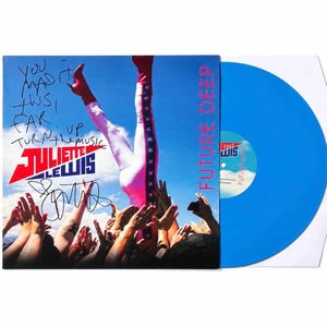 May include: A blue vinyl record and album cover for "Future Deep" by Juliette Lewis. The album cover shows a person in red boots and white trousers with a pink stripe and stars, with the text "YOU MADE IT THIS FAR! TURN THE MUSIC UP".