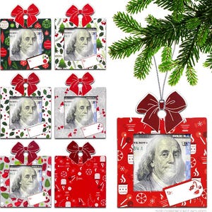 May include: Six red and white Christmas ornament gift card holders with a bow on top. Each holder has a frame for a dollar bill and a blank tag for writing a message. The ornament is hanging from a tree branch.