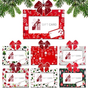 May include: Six red and green Christmas gift card holders with a bow on top. Each holder has a white frame with the words "Gift Card" printed on it. The holders are decorated with various Christmas designs, including snowflakes, ornaments, and candy canes.