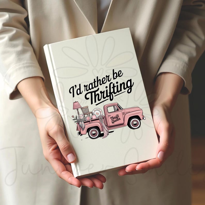 May include: A cream-coloured journal featuring the text "I'd rather be Thrifting" in black script. A pink pickup truck graphic is filled with thrifted items. The truck has the words "Thrift Queen" on the side.