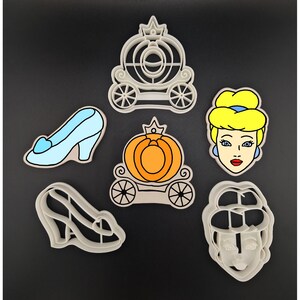 May include: Set of six Cinderella-themed cookie cutters, including a pumpkin carriage, a glass slipper, and Cinderella's face.