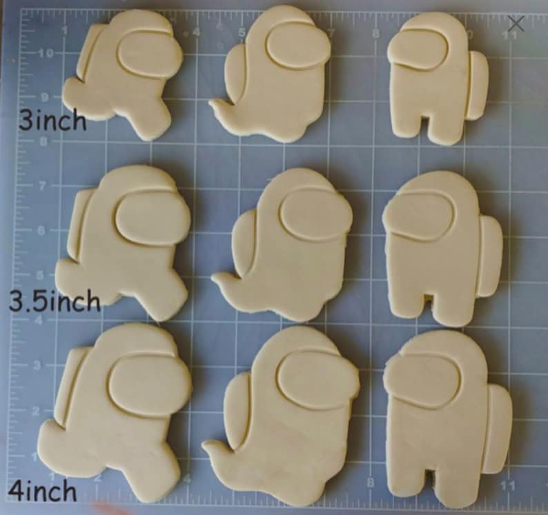 May include: Nine cookie cutters in various sizes, shaped like the character from the video game Among Us. The cutters are 3 inches, 3.5 inches, and 4 inches in size.