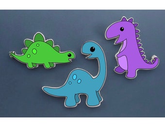 May include: Three cartoon dinosaur figures. One is green with a spiky back, one is blue with a long neck, and one is purple with a spiky back.