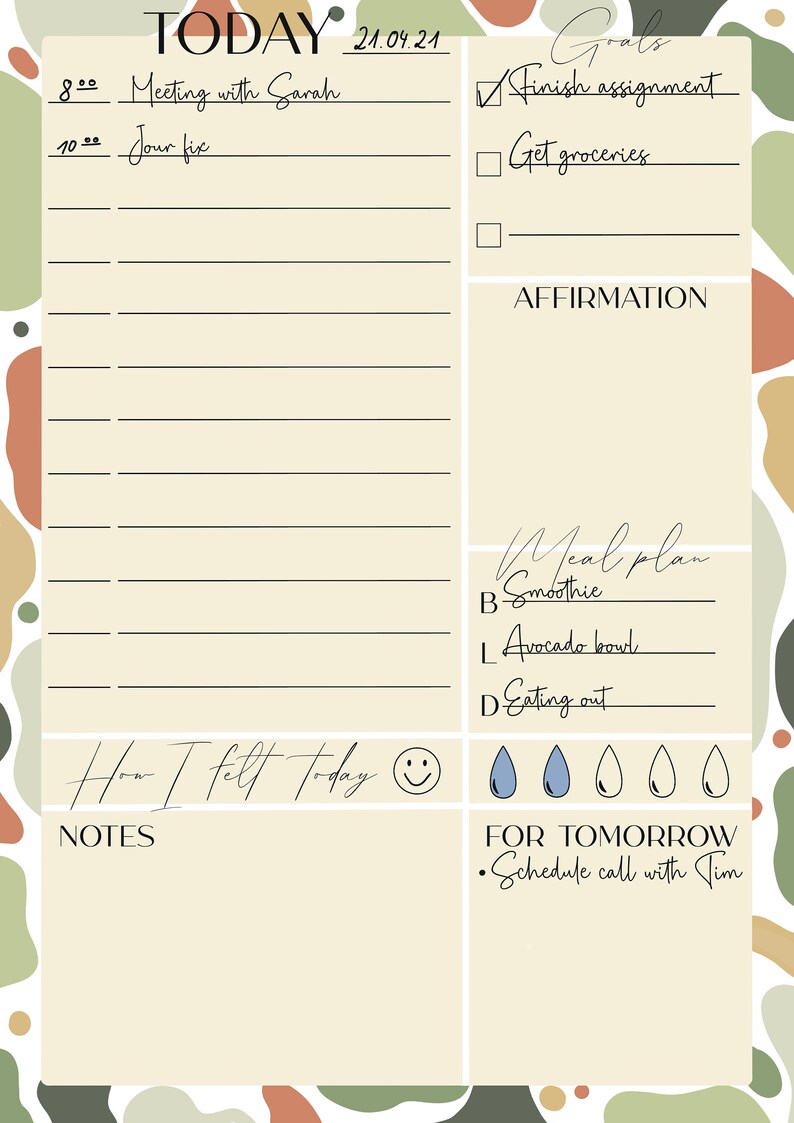 May include: A beige daily planner with a light brown, green, and orange abstract background. The planner has sections for goals, affirmations, meal plans, and notes. The planner also includes a section for "How I felt today" with a smiley face and water drop icons. The date is 21.04.21.