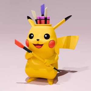 May include: A yellow Pikachu figure holding a paintbrush with a red tip and black handle. The figure has a container on its head with various art supplies. The figure has black eyes, red cheeks, and a smiling expression. The background is a light pink.
