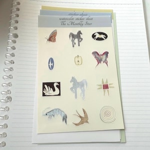 May include: A sheet of watercolor stickers with various illustrations, including butterflies, horses, and a swan. The text "sticker sheet", "watercolor sticker sheet", and "The Monthly Star" is visible.