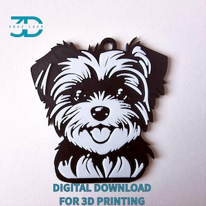 May include: Black and white 3D printed model of a Yorkshire Terrier dog's head. The model is printed in a solid black color with white details for the fur, eyes, and nose. The model is designed for 3D printing and is available for digital download.