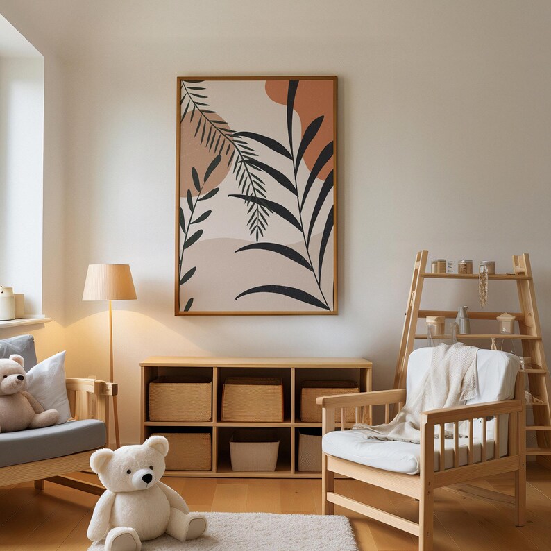 May include: A living room interior with a wooden shelf unit, a wooden armchair with a white throw blanket, a floor lamp, and a framed print of an abstract design with black leaves and brown and beige shapes.