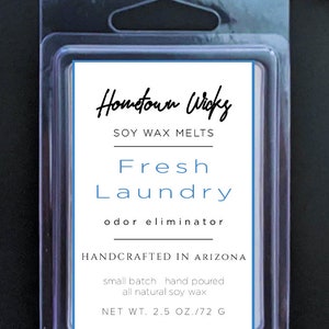 May include: A clear plastic container with a white label that reads "Hometown Wick" Soy Wax Melts Fresh Laundry odor eliminator Handcrafted in Arizona small batch hand poured all natural soy wax NET WT. 2.5 OZ./72 G"