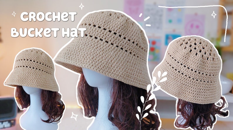 May include: A crocheted bucket hat in a light beige color. The hat has a wide brim and a crocheted design with holes throughout. The hat is displayed on a mannequin with brown hair.