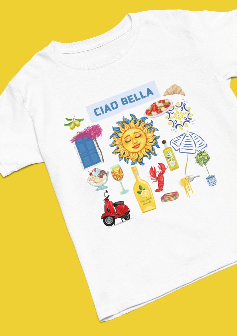 May include: White t-shirt with a colorful illustration of Italian icons, including a sun, a scooter, a glass of wine, a bottle of limoncello, a lobster, a plate of pasta, a croissant, a plate of caprese salad, a blue door, a potted olive tree, and a beach umbrella. The text "Ciao Bella" is printed in blue on a light blue background.